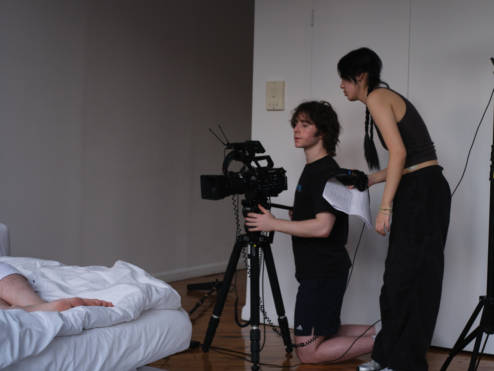 Finding composition for scene, actor in bed